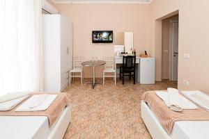 TV a/nebo společenská místnost v ubytování Hotel Fama