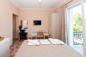 Postel nebo postele na pokoji v ubytování Hotel Fama