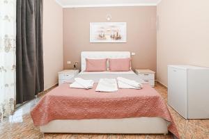 Postel nebo postele na pokoji v ubytování Hotel Fama