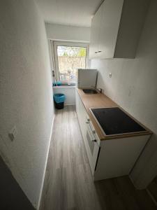 a kitchen with a sink and a counter top at SpeedStay - Duisburg Marxloh in Duisburg