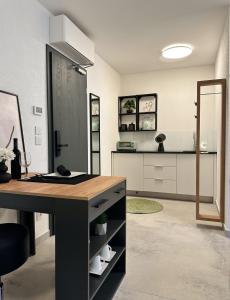 a kitchen with a desk and a counter top at Stylish Unit in Komarna - Idyllic Retreat in Komarna