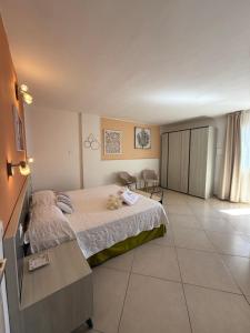 a bedroom with a bed and a table in it at Residenza Al Castello in Carloforte