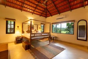 Postel nebo postele na pokoji v ubytování Raindrops Resorts Wayanad + 37 fotografií