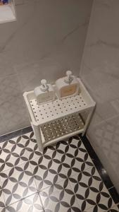 two soap boxes sitting on a shelf in a bathroom at Lexington Hotel in Ho Chi Minh City