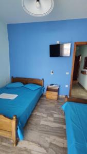 Postel nebo postele na pokoji v ubytování Ainalis Apartments
