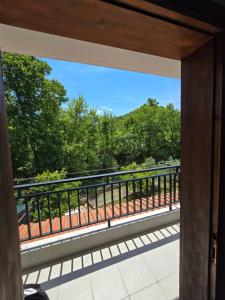a view from the balcony of a house at Exohi apartments in Nea Vrasna