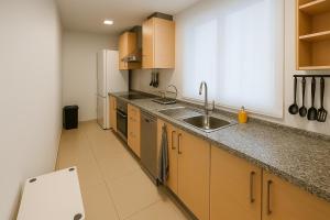 Kuchyň nebo kuchyňský kout v ubytování Habitación en ático dúplex