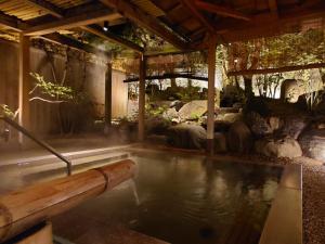 a large pool of water in a room with at Kasuga Hotel in Nara