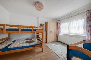 Ένα ή περισσότερα κρεβάτια σε δωμάτιο στο Guesthouse Niederschlag - BBQ, Sauna & Fun