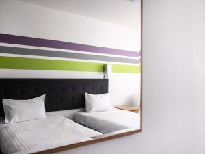 Postel nebo postele na pokoji v ubytování ibis Styles Bielsko Biala