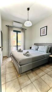 a bedroom with a large bed in a room at Melintas cozy apartments 2 in Plomari