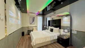 Postel nebo postele na pokoji v ubytování M&H Lux Hotel