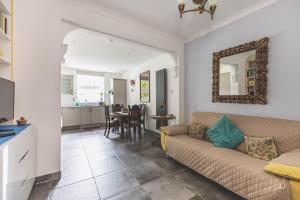 a living room with a couch and a table at Stylish Flat B in London