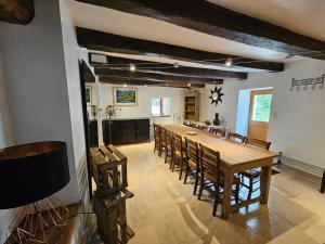 a large dining room with a long table and chairs at Moulin Cottage - Germaines in Germaines