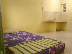 En eller flere senge i et værelse på Guest House Griya Mas BCI A 39A + 21 billeder