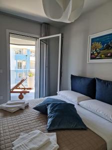 a bedroom with a bed with a view of a patio at La Vela Luxury Apartment in Pescara