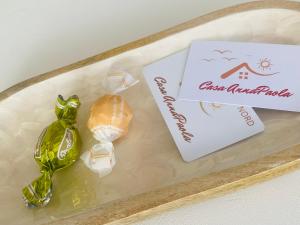 a tray with a sandwich and a sign on it at Casa AnnaPaola Luxury in Chioggia +33 photos