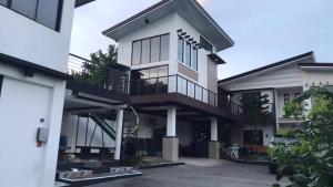 a large white house with a lot of windows at Casa Prinza Luxury Suite in Teresa