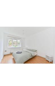 Ένα ή περισσότερα κρεβάτια σε δωμάτιο στο Spacious 3 bedroom - Crystal Palace