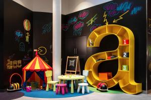 a room filled with colorful decorations and toys at Ibis Styles Budapest Center in Budapest