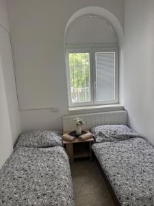 Postel nebo postele na pokoji v ubytování Perfekt group