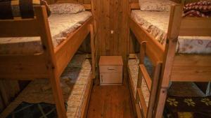 a room with two bunk beds in a cabin at Bayrams Tree Houses in Olympos