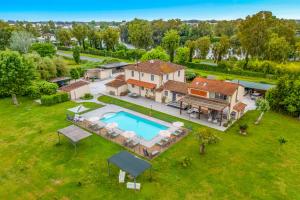 an aerial view of a house with a swimming pool at VISTALAGO VERSILIA in Massarosa