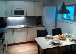 Kuchyňa alebo kuchynka v ubytovaní Apartments Světluška