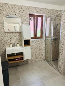 a bathroom with a sink and a shower at app Manja1 in Novigrad Istria
