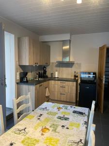 a kitchen with a table with a tablecloth on it at Ca’Benvenuto in Doische