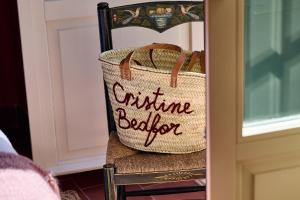 a basket sitting on a chair next to a door at Cristine Bedfor Malaga Boutique Hotel in Málaga +53 photos