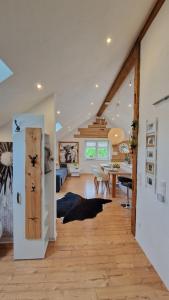 a room with a living room and a dining room at FeWo Familie Thoma in Argenbühl