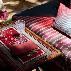 a table with a book on top of a couch at Cristine Bedfor Malaga Boutique Hotel in Málaga