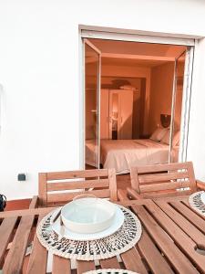 a wooden table with a plate on top of it at Rooftop 24 in Calpe