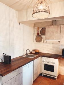 a kitchen with a sink and a counter top at Rooftop 24 in Calpe