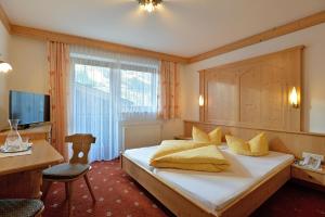 Postel nebo postele na pokoji v ubytování Hotel Garberwirt