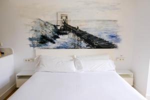 Postel nebo postele na pokoji v ubytování Boulevart Donostia
