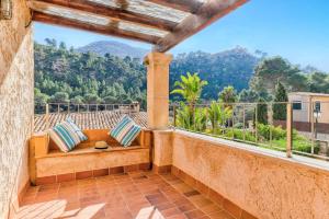 a balcony with a view of the mountains at Villa Can March by Villa Plus in Cala de Sant Vicenc