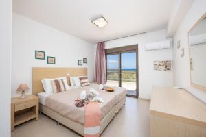 Ένα ή περισσότερα κρεβάτια σε δωμάτιο στο Villa Blue Wave Tria +32 φωτογραφίες