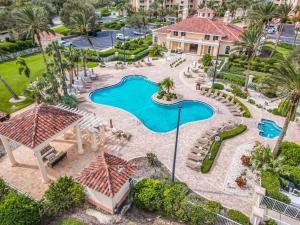 an aerial view of a pool at a resort at Luxury Minorca with Ocean and River Views in Paros 601 in New Smyrna Beach