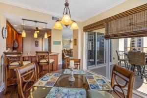 a dining room with a table and chairs at Luxury Minorca with Ocean and River Views in Paros 601 in New Smyrna Beach
