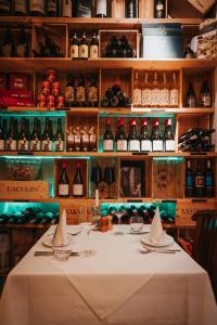 a table in a room with bottles of wine at Altes Gasthaus Nagel in Niederdorla