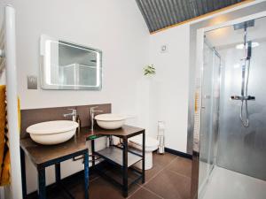 a bathroom with two sinks and a shower at 5 Bed in Huntley 75701 in Huntley +29 photos