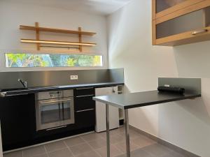 Η κουζίνα ή μικρή κουζίνα στο Appartement Rez de chaussée +10 φωτογραφίες