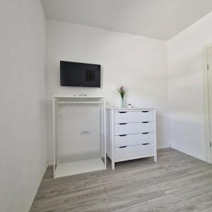 a room with a dresser and a tv on a wall at Vila Natasa Apartment 2 near Plitvice in Vrhovine +32 photos