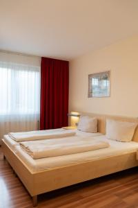 Postel nebo postele na pokoji v ubytování Autohof Hotel Salzbergen