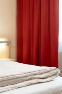 Postel nebo postele na pokoji v ubytování Autohof Hotel Salzbergen