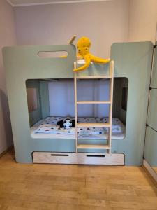 a toy bunk bed with a cat sleeping in it at LINDENGUT - Boutique Hotel nahe IKUNA Park in Natternbach +208 photos