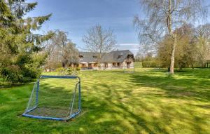 a yard with a goal in front of a house at La Charmille in Saint-Étienne-lʼAllier +15 photos