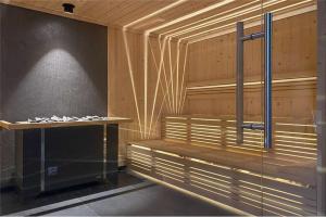 a sauna with a bench in the middle of a room at Comfortable apartment, sauna Żywiec Lake in Zarzecze